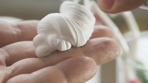 A man in front of a bathroom mirror squeezes shaving foam onto his hand and Stock Footage 100722549