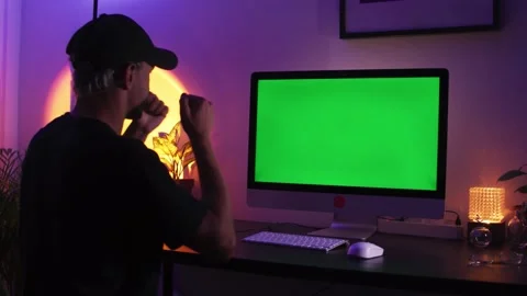 Man in front of a brick wall with a beard and in a white T-shirt works in the Stock Footage 184844878