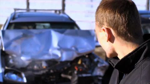 Man in front of car crash Видео 36806574