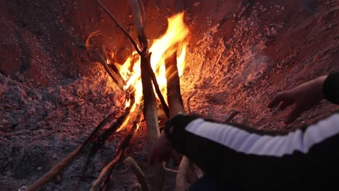 A man in front of the fire to wram up Stock Footage 129530185