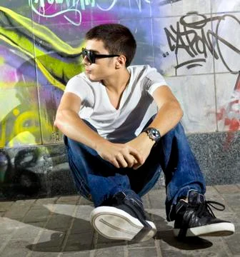 Man in front of graffiti wall Stock Photos