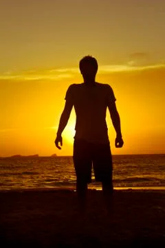 Man in front of the sunset Stock Photos