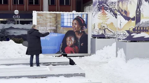 Man in front of Unicef advertising panel Video stock 328009771