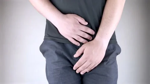 Man front view. Pain in the groin and bladder. The concept of pain in men as a r Stock Footage 130247667