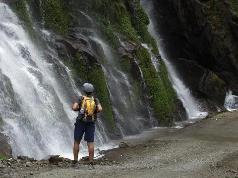 A man in front of waterfall Stock Photos