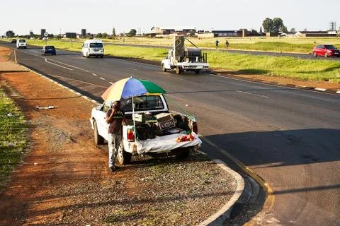 Man with Fruit Boxes on the back of his Bakkie Stock Photos