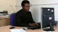 Man is frustrated at work and hits monitor HD Footage