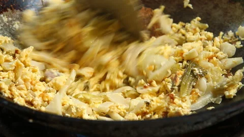 Man is frying Pickled Cabbage  with egg in pan, in door  Chiangmai  Thailand Stock-Footage 167548898