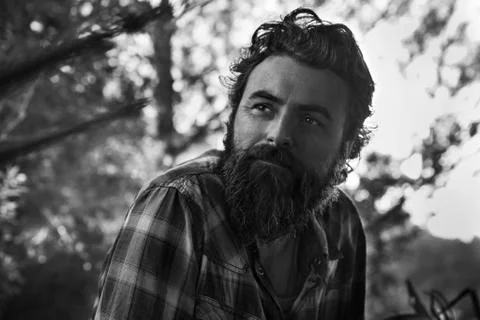 Man with full beard thinking Stock Photos