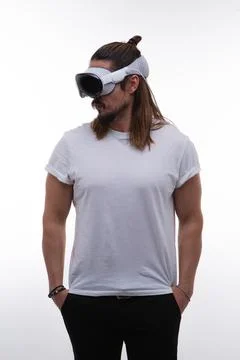 A man fully engaged in a spatial computing experience with a AR headset Stock Photos