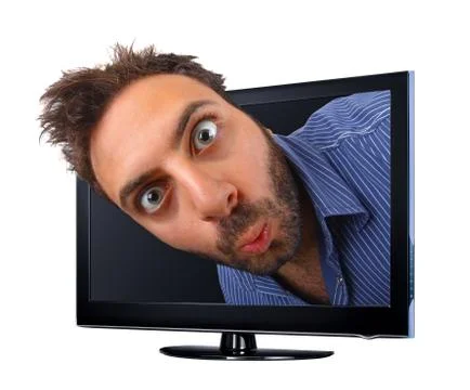 Man with funny expression jumping out of the TV Stock Photos