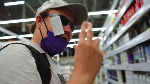 Man with funny glasses smiles at the camera Stock Footage 137300573