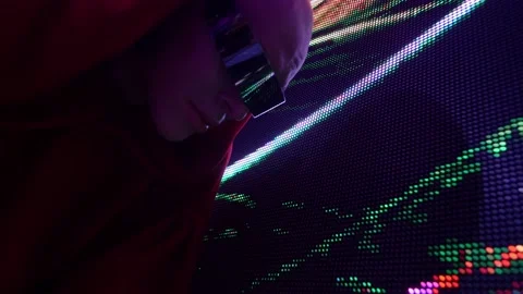 A man from the future in glasses interacts with an LED screen 库存影片 171231823