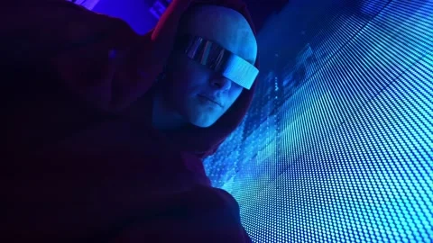 A man from the future in glasses interacts with an LED screen Video stock 171232274