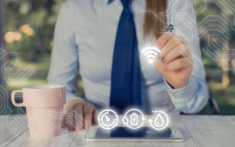 Man In Futuristic Infographics Interface Elements On Blurred Using Free Wi Fi Foto stock