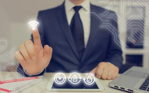 Man In Futuristic Infographics Interface Elements On Blurred Using Free Wi Fi Foto stock