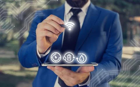 Man In Futuristic Infographics Interface Elements On Blurred Using Free Wi Fi Foto stock