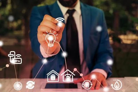 Man In Futuristic Infographics Interface Elements On Blurred Using Free Wi Fi Foto stock