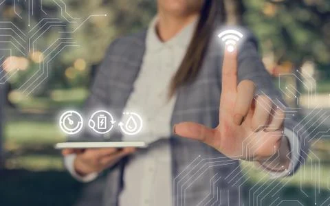 Man In Futuristic Infographics Interface Elements On Blurred Using Free Wi Fi Foto stock