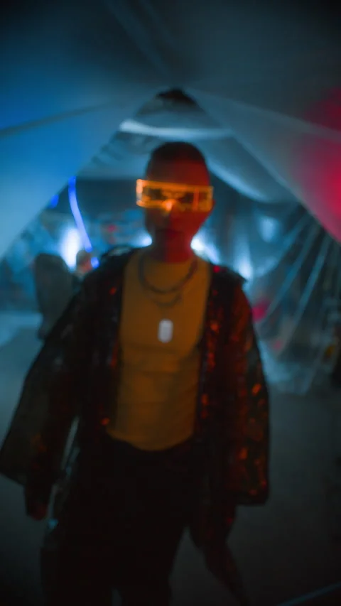 Man in Futuristic Visor Interacting with Invisible Panel in Cyberpunk Workspace Stock Footage 327639214