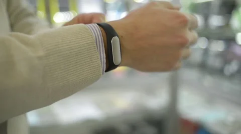 Man with gadget that measures the pulse at the wrist Stock Footage 58697374
