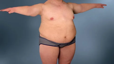 Man gaining weight, enlarged belly Stockbeeldmateriaal 345199466