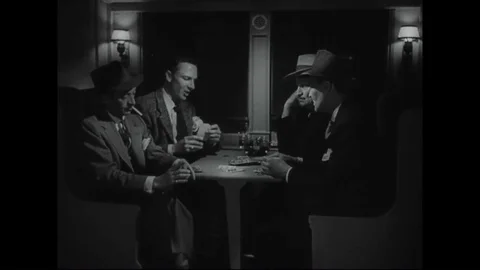 A man gambles, drinks, and gets suckered and robbed during the 1940s Stock-Footage 84048380