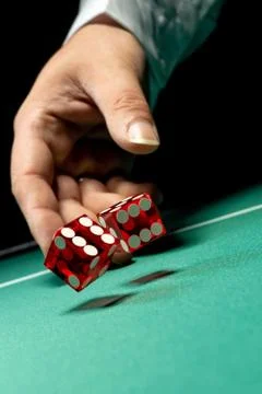 Man gambling at the craps table Stock Photos