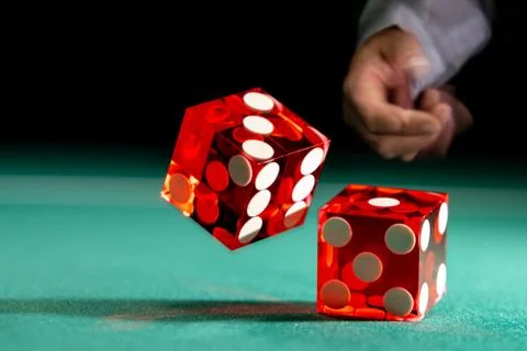 Man gambling at the craps table Stock Photos