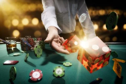 Man gambling at the craps table Stock Photos
