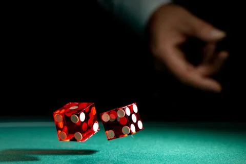 Man gambling at the craps table Stock Photos