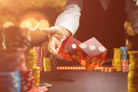 Man gambling at the craps table Stock Photos