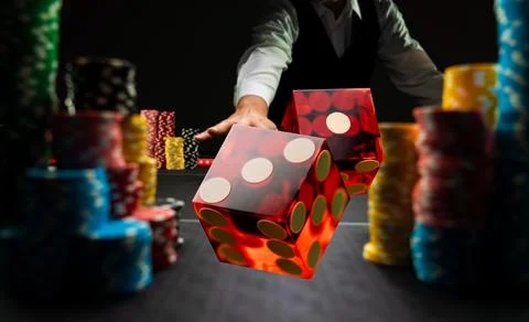 Man gambling at the craps table Stock Photos