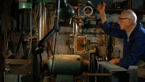 Man in garage workshop using drilling machine. Stock Footage 72163513