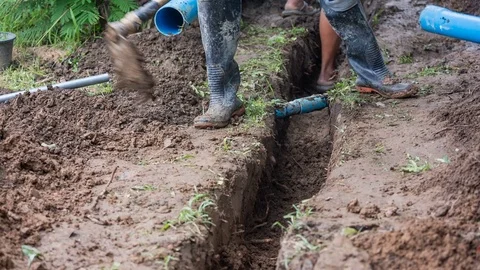 The man in the garden with a hoe digging a hole in the ground Video stock 82397781