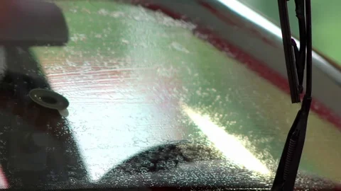 The man at the gas station washes the windshield Video stock 77235694
