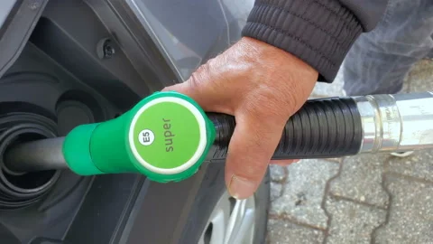 Man at Gas station while refueling a car,increasing petrol costs concept Stock Footage 162784950