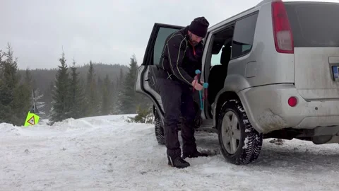 Man Gearing Up For Winter Hike Stock Footage 170304145