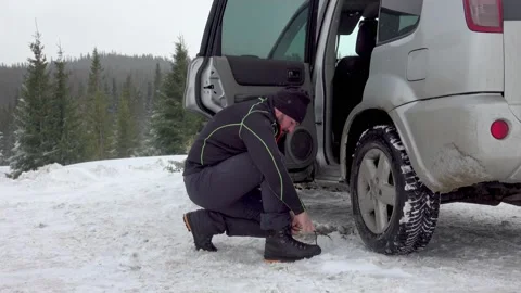 Man Gearing Up For Winter Hike Stock Footage 170304236