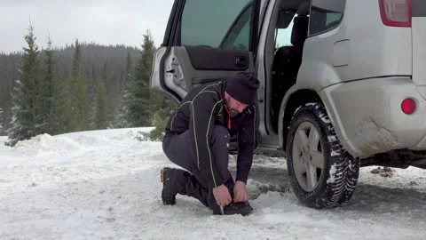Man Gearing Up For Winter Hike Stock Footage 220736736