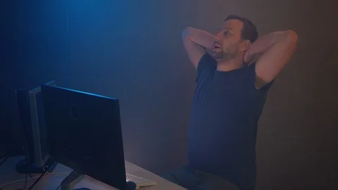Man geek hacker is working at computer Stock Footage 90979806