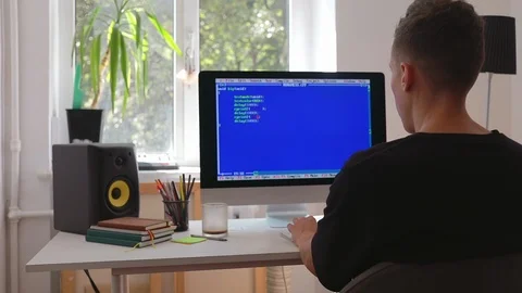 Man geek hacker in working at computer writing programming code for new business Stock Footage 115491745
