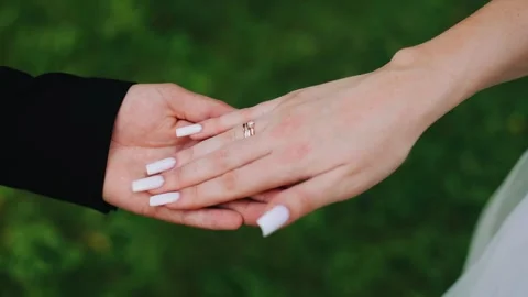 The man gently takes his lover's hand Stock Footage 308870627