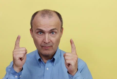 The man gestures with both hands. Stock Photos