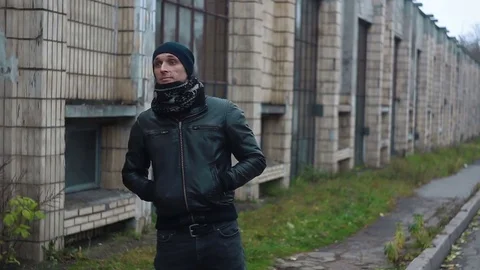 The man gestures to someone that he is here 스톡 동영상 82117016