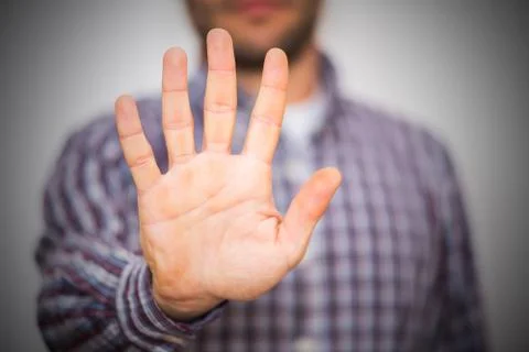 Man gesturing alt or stop with hand Stock Photos