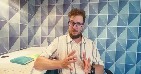 Man Gesturing and Talking in Modern Office Stock Footage 323581023