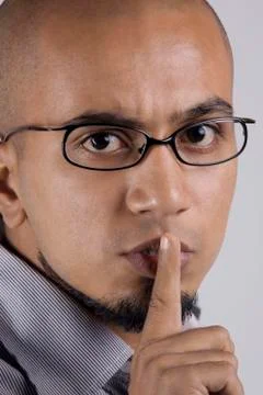 Man gesturing to be quiet Foto stock