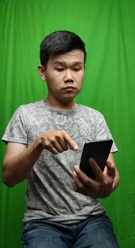 A Man Gesturing with Confidence and Direction by Pointing the Way 库存照片