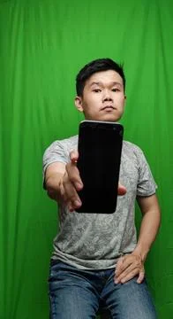 A Man Gesturing with Confidence and Direction by Pointing the Way Stock Photos